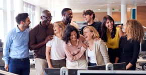 Happy Business Team Working In Modern Office Laughing Together